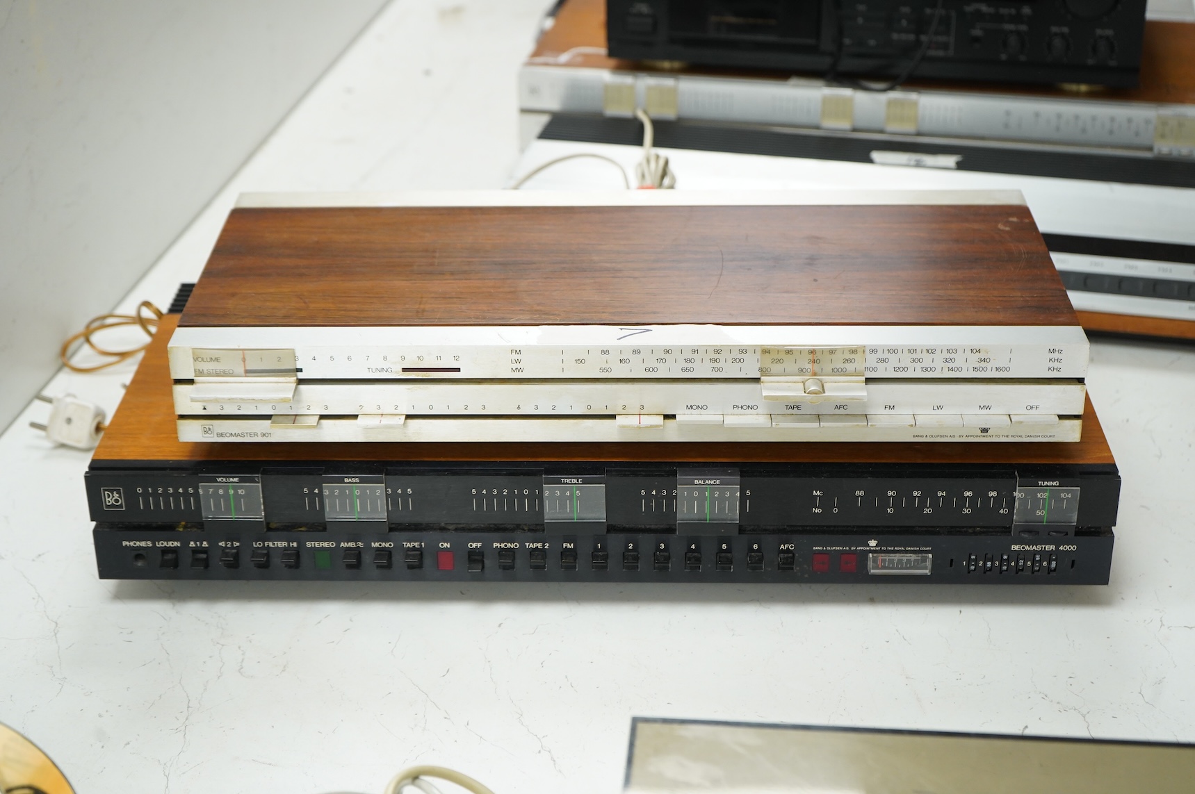 Four Bang & Olufsen stereo items; a Beogram 1000 type 5229 turntable, a Beomaster 4000 type 2406, a Beomaster 901 type 2606, and a Beomaster 1900 type 2903